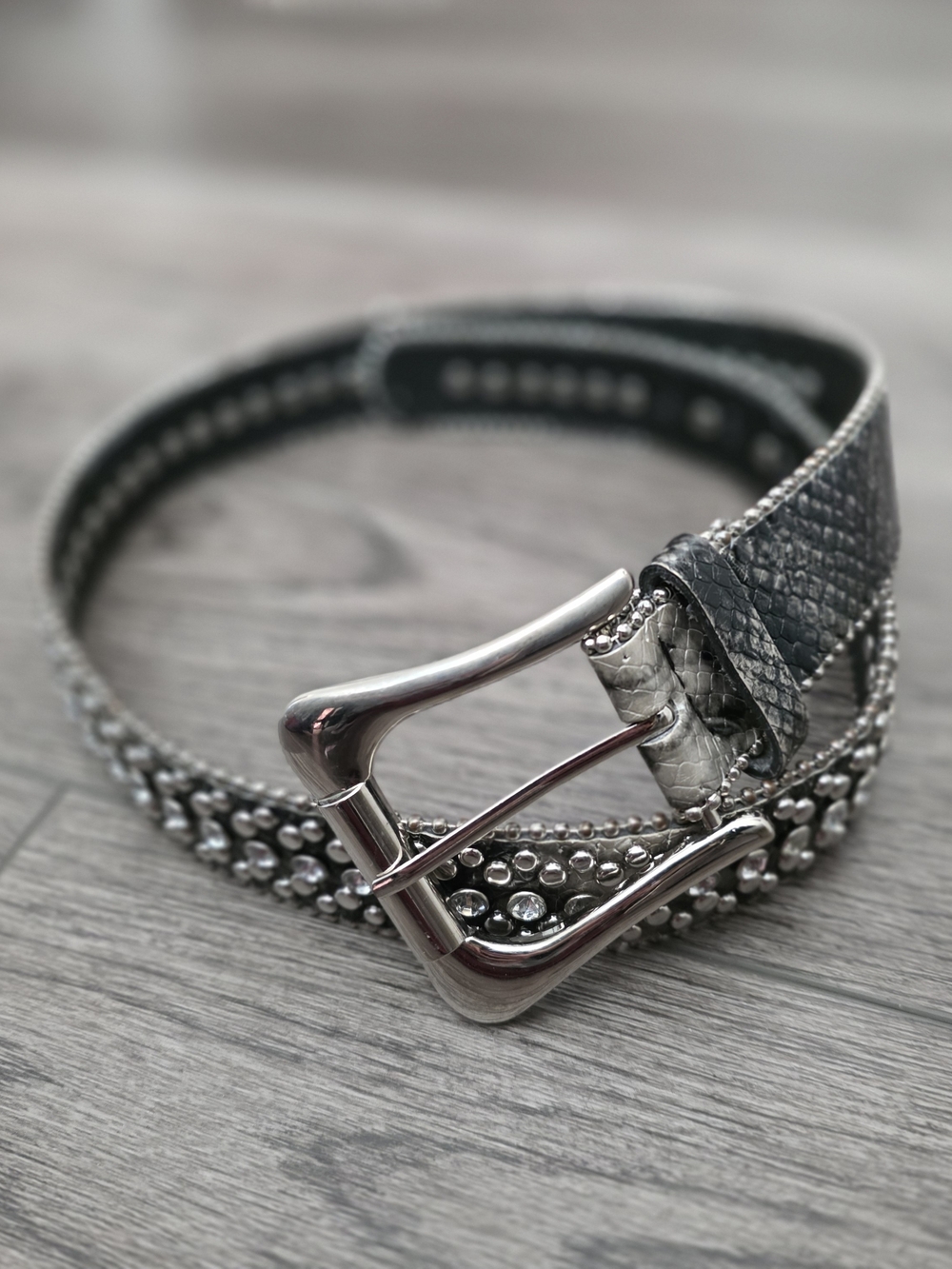 Black/grey faux snake belt with decorative silver studs and rhinestones